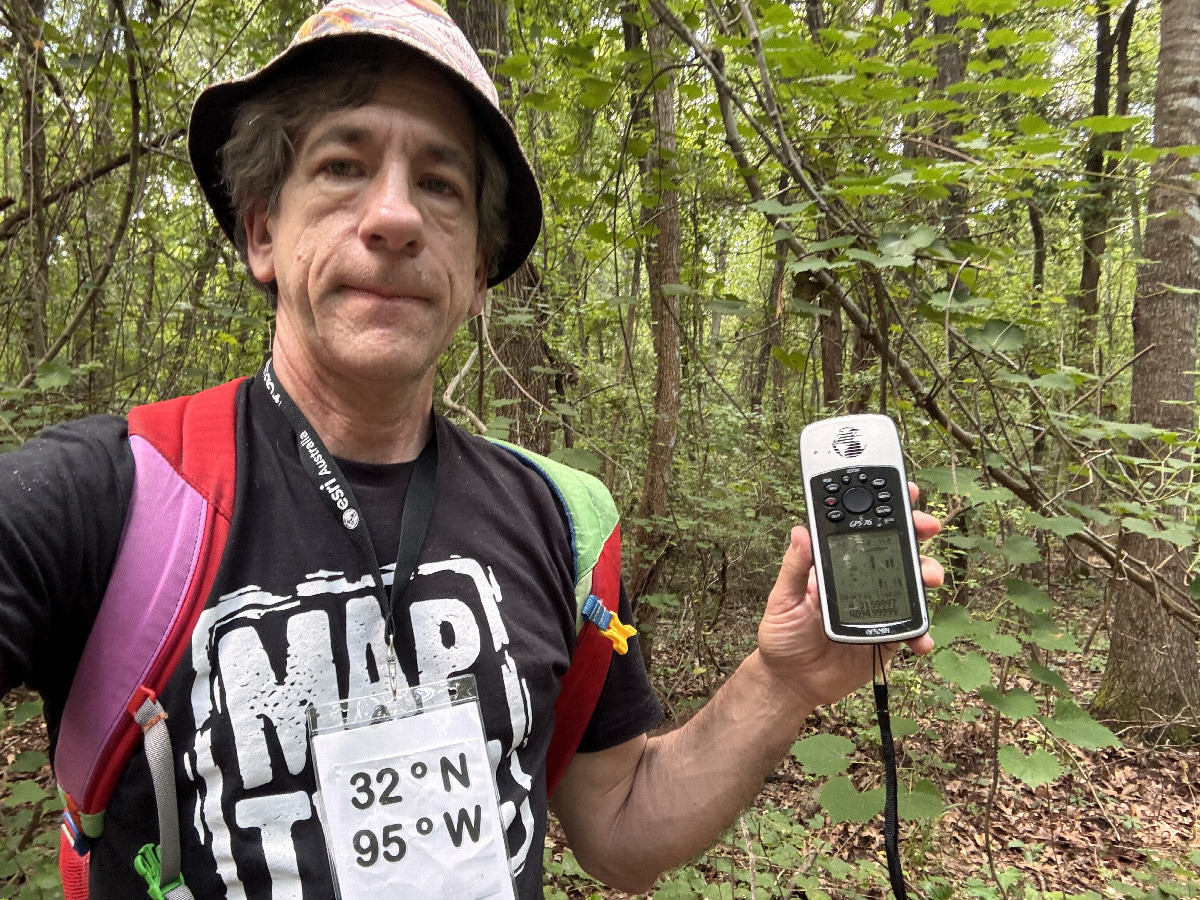Joseph Kerski with mapping shirt at the confluence point.