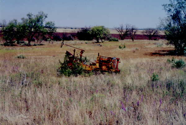 Tractor in retirement east of confluence.