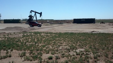 #1: Oil well pump jack as seen from the confluence