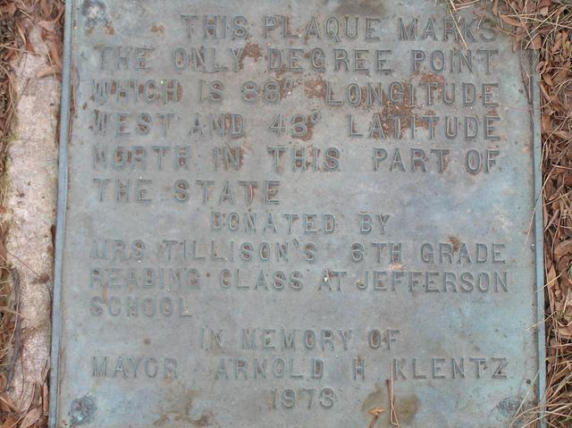 Plaque commemorating the confluence, at corner of West Deyer Place and S. 70th St., 15 meters north of the confluence.