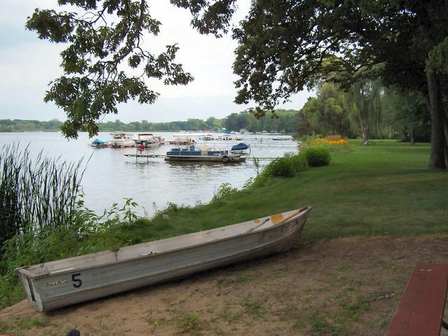 Boat and shore in front of confluence cottage.