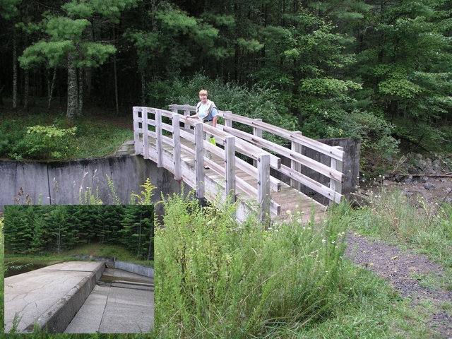 Taking the trail over this wooden bridge eliminates any need to cross the spillway at the earthen dam.