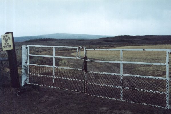 First locked gate, looking south.  Confluence is 2.74 kilometers away.