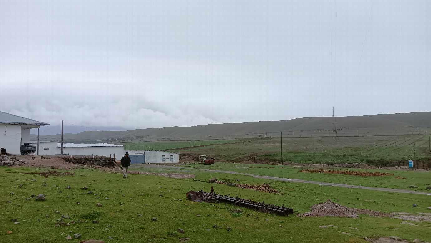 West view, farmer is coming