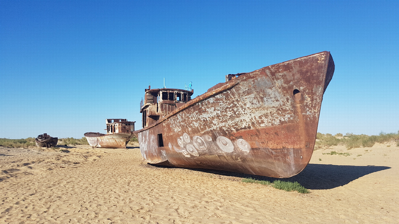 fishing fleet stranded on desert sand at Muynak - most famous symbol of the man-made catastrophe 