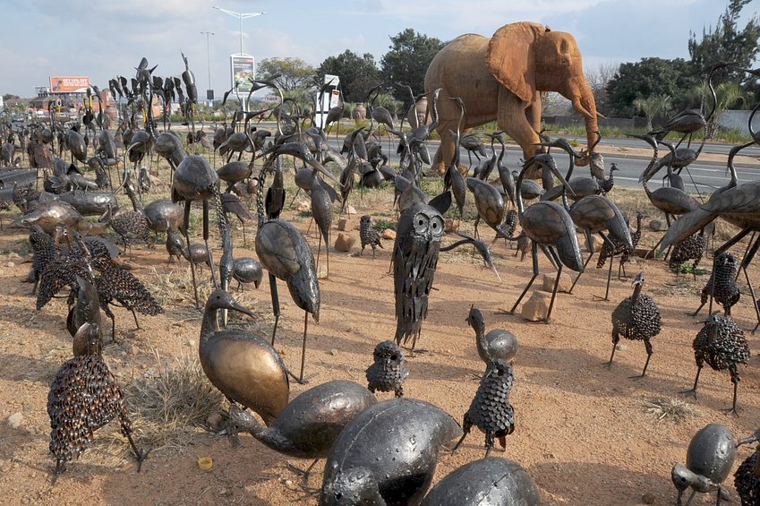 Roadside metal sculptures by Zimbabwean refugees ranging from owls to elephant