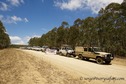 #5: Land Cruisers parked along the road