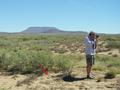 #7: My brother Cecil, taking the shots for a panoramic 360°. The GPS is pointed out by the red arrow.